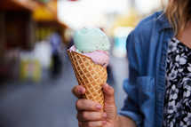 a woman holding ice cream 
