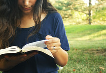 a young woman reading a Bible, girl, female