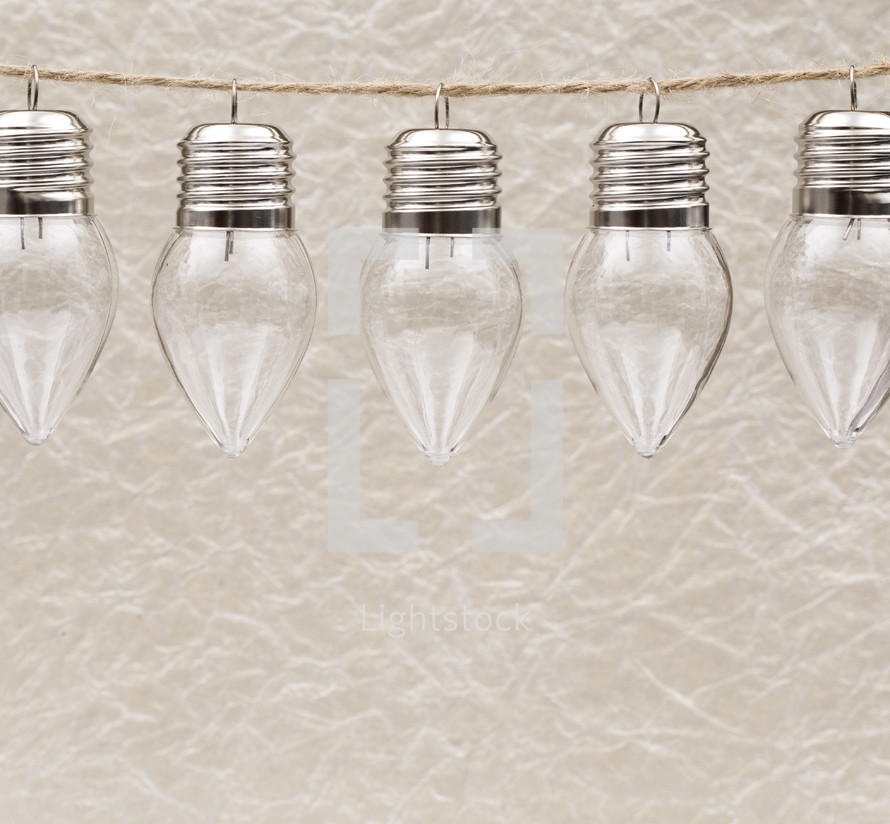 clear glass bulbs hanging on a string 