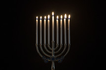 lit candles on a menorah.