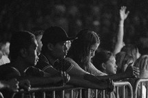 youth praying at a youth rally 