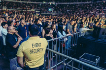 fans standing near a stage 