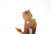 a woman listening to music as she trains 