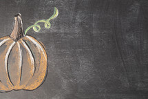 pumpkin on chalkboard