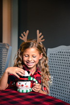 smiling child with hot cocoa 