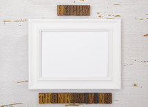 frame with happy thanksgiving wood stamps 