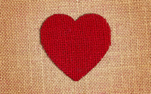 Red Burlap Heart on a brown burlap Background