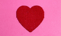 Red Burlap Heart on a Pink Background