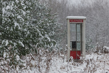 snow on a telephone booth 