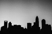 silhouettes of city buildings 