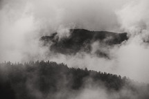 fog and clouds over a mountain top