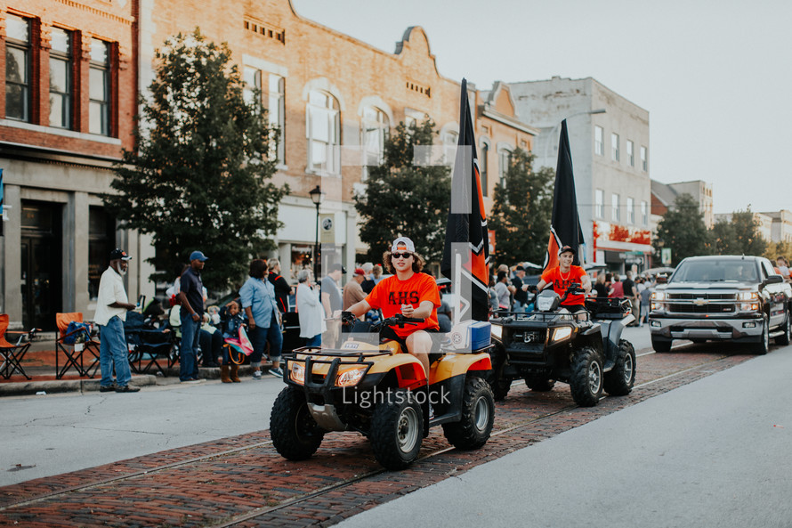 four wheelers in a parade 