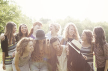 Group of young women, laughing and talking, posing for picture