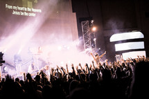 Silhouette of audience at a Christian rock concert.
