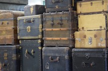 vintage luggage and trunks at an old train depot 