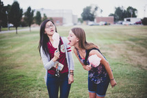 teen girls eating cotton candy 