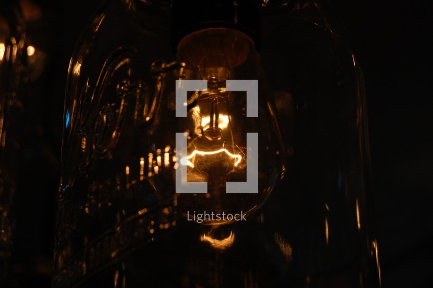 glowing lightbulb in a mason jar