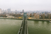 aerial view over a city and bridge 