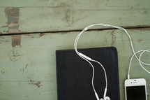 Bible and iPhone and earbuds 