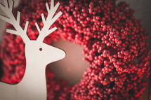 red berry wreath and reindeer 