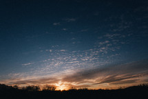 clouds above a horizon at sunset 