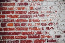 brick wall with white paint faded away background 