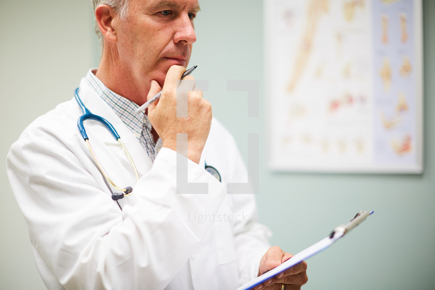 a doctor holding a clipboard 