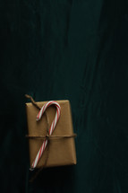 wrapped gift with candy cane 