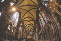 ceiling and stained glass windows in a cathedral 