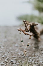 wooden beads on a branch 