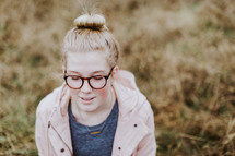 headshot of a teen girl with glasses 