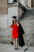 a woman in a red dress at graduation 