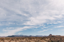 clouds above a desert landscape 