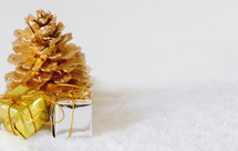 gold pine cone and small gifts 