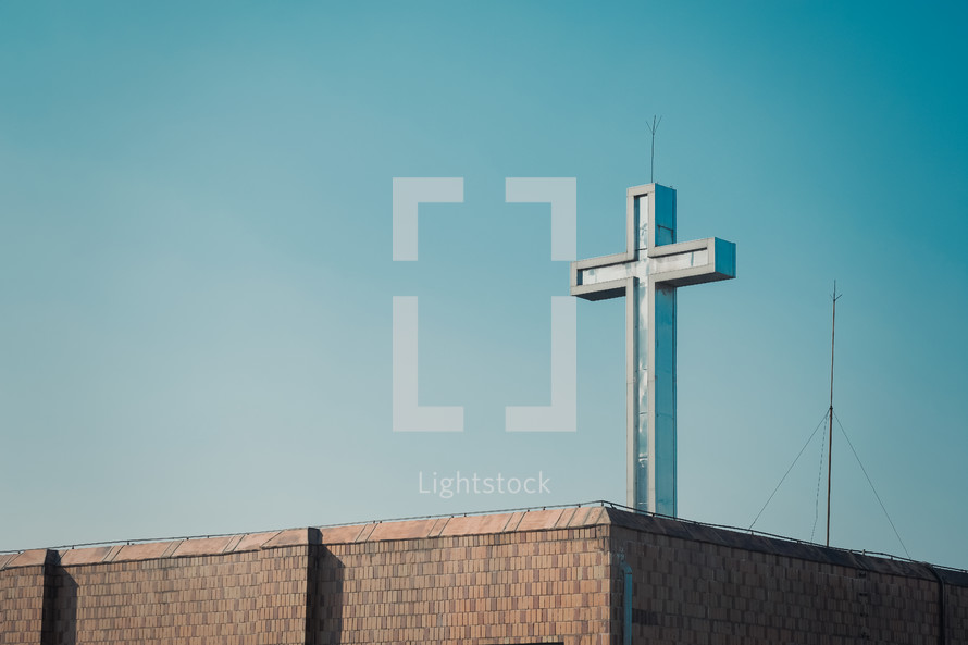 brick rooftop with cross