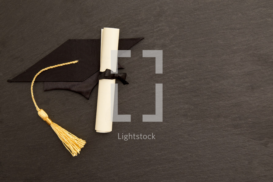 Symbols Representing Graduation on a Chalkboard