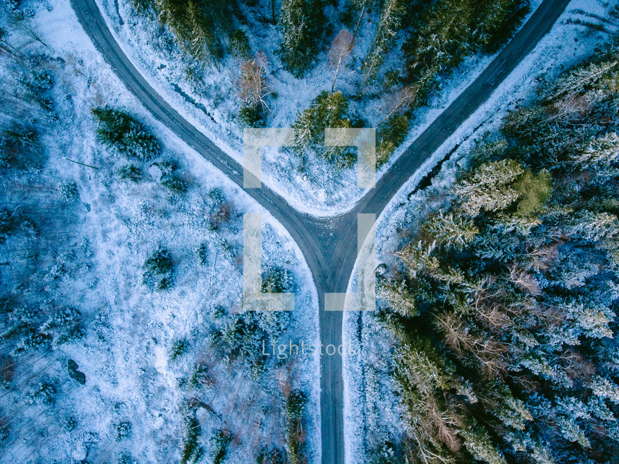 aerial view over a snowy highway 