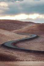 curvy road on desert mountains 