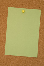 blank paper pinned to a cork board 