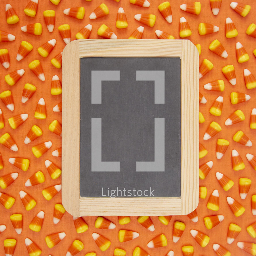 candy corn background with blank sign 