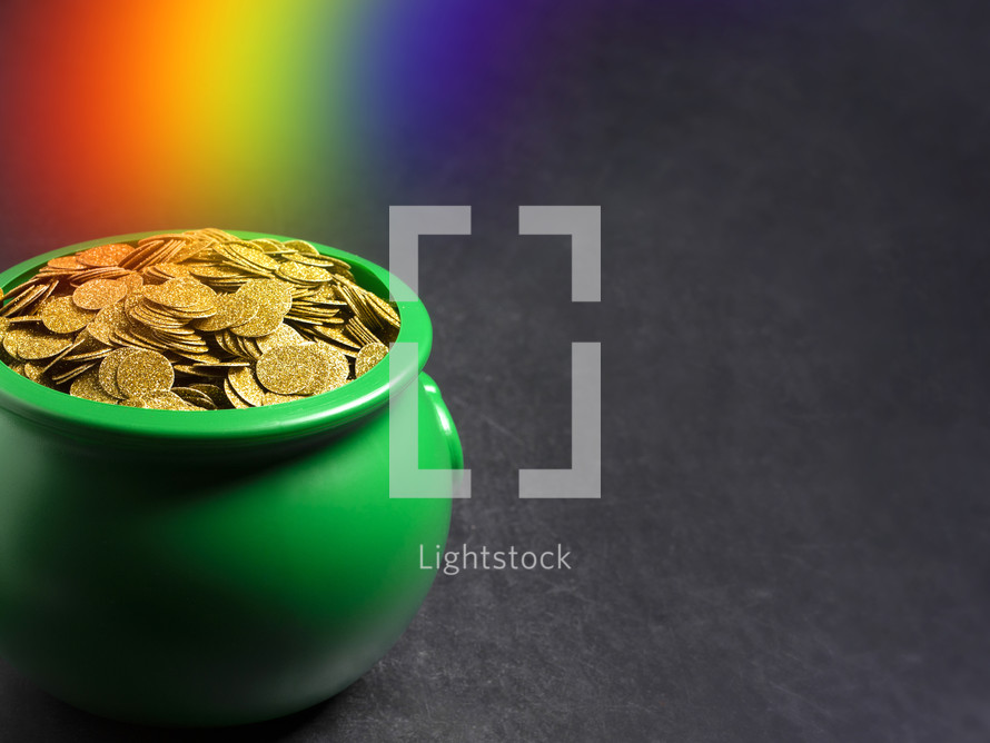 rainbow Pot Full of Golden Coins Isolated on a black Background