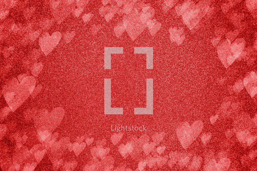 red sparkle background with bokeh hearts 