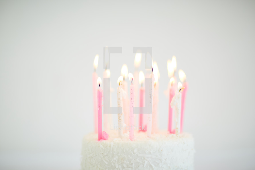 flames on candles on a birthday cake 
