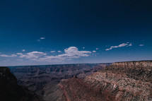 White clouds and blue sky over the Grand Canyon.
