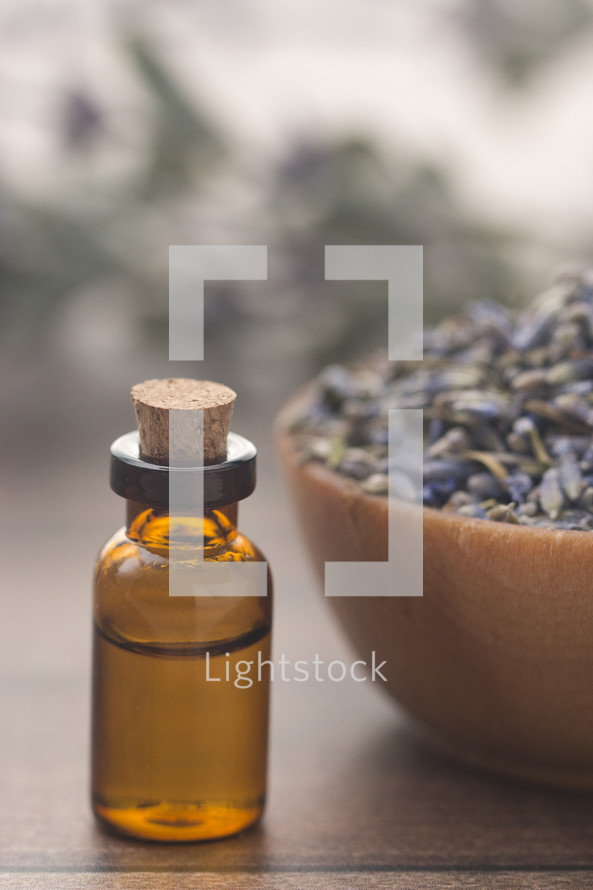 essential oil bottle and dried lavender 