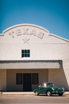 a vintage car under a building in Texas 
