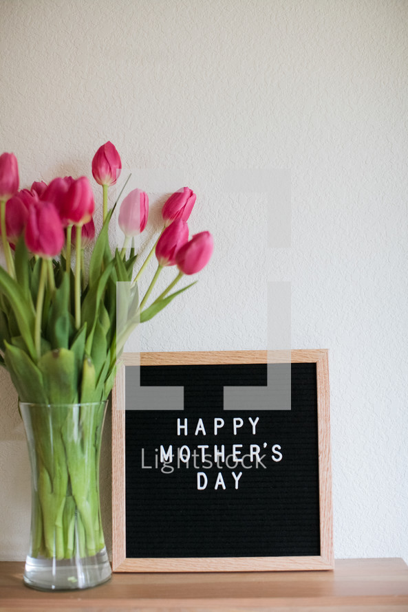 tulips in a vase and a Happy Mother's day sign 