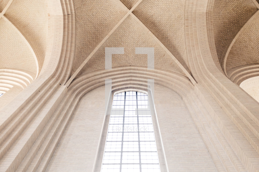 arched ceiling and tall windows in a cathedral 