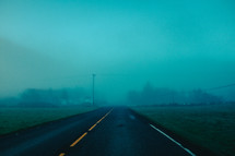 a foggy rural road 
