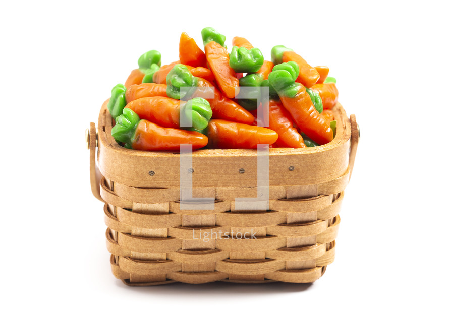 candy gummy carrots in a basket for Easter 